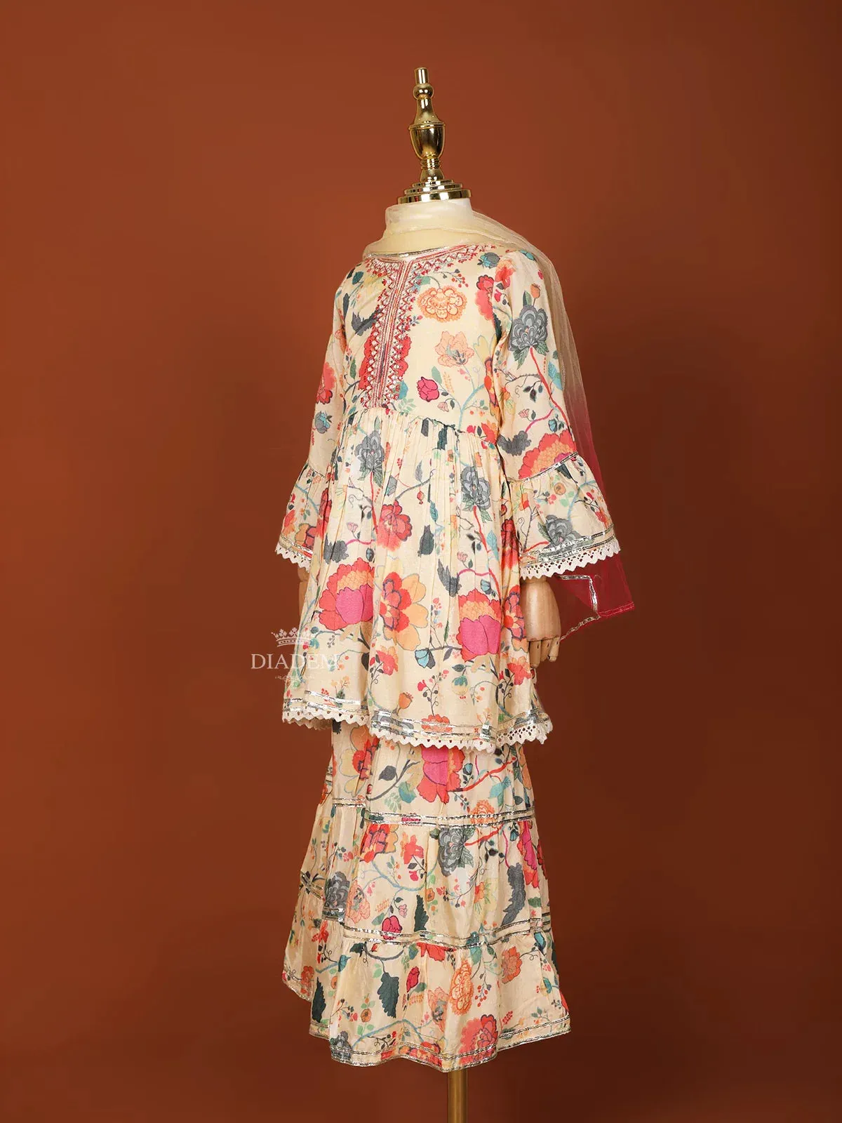 Cream Georgette Sharara Set with Floral Prints and paired with Dupatta